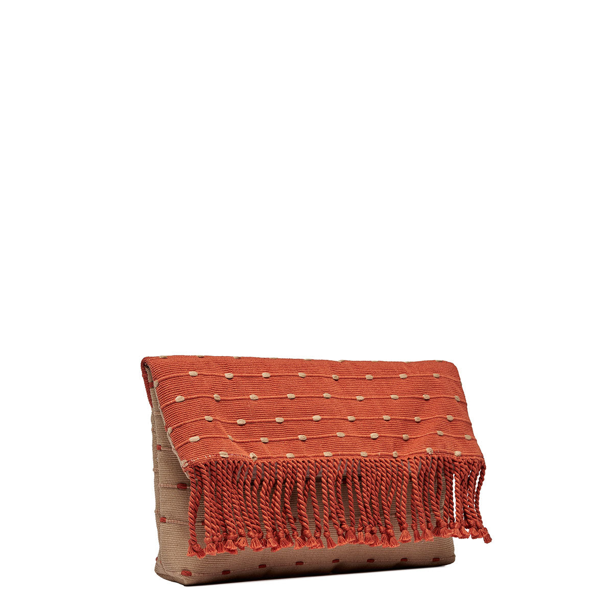 Side angle view of the Margarita Clutch in Desert Sands. pattern is coral pink with horizontal beige dots. It has pink fringe. The clutch is folded over. 