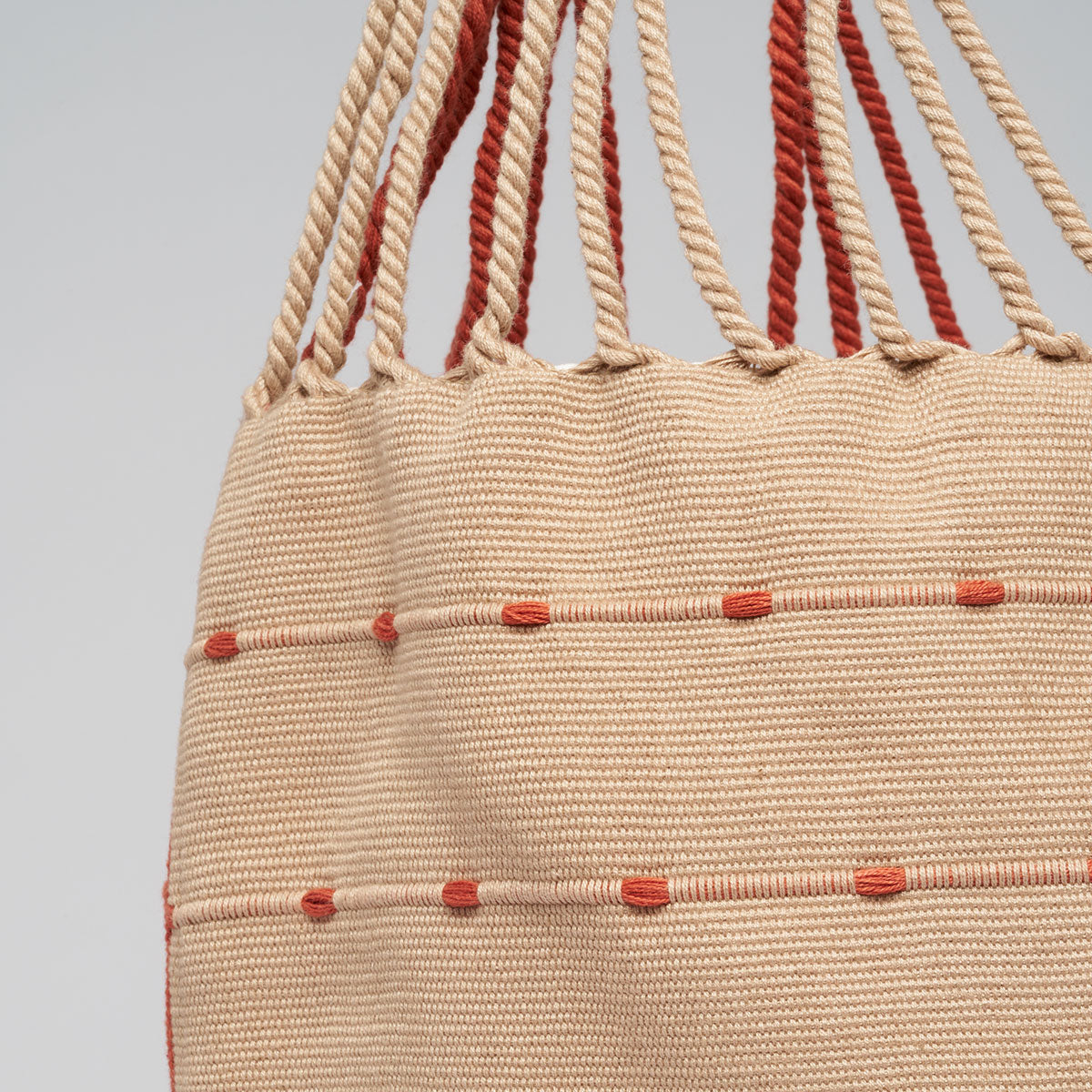 Close up detail of the back of the Apolonia Tote in Desert Sands.