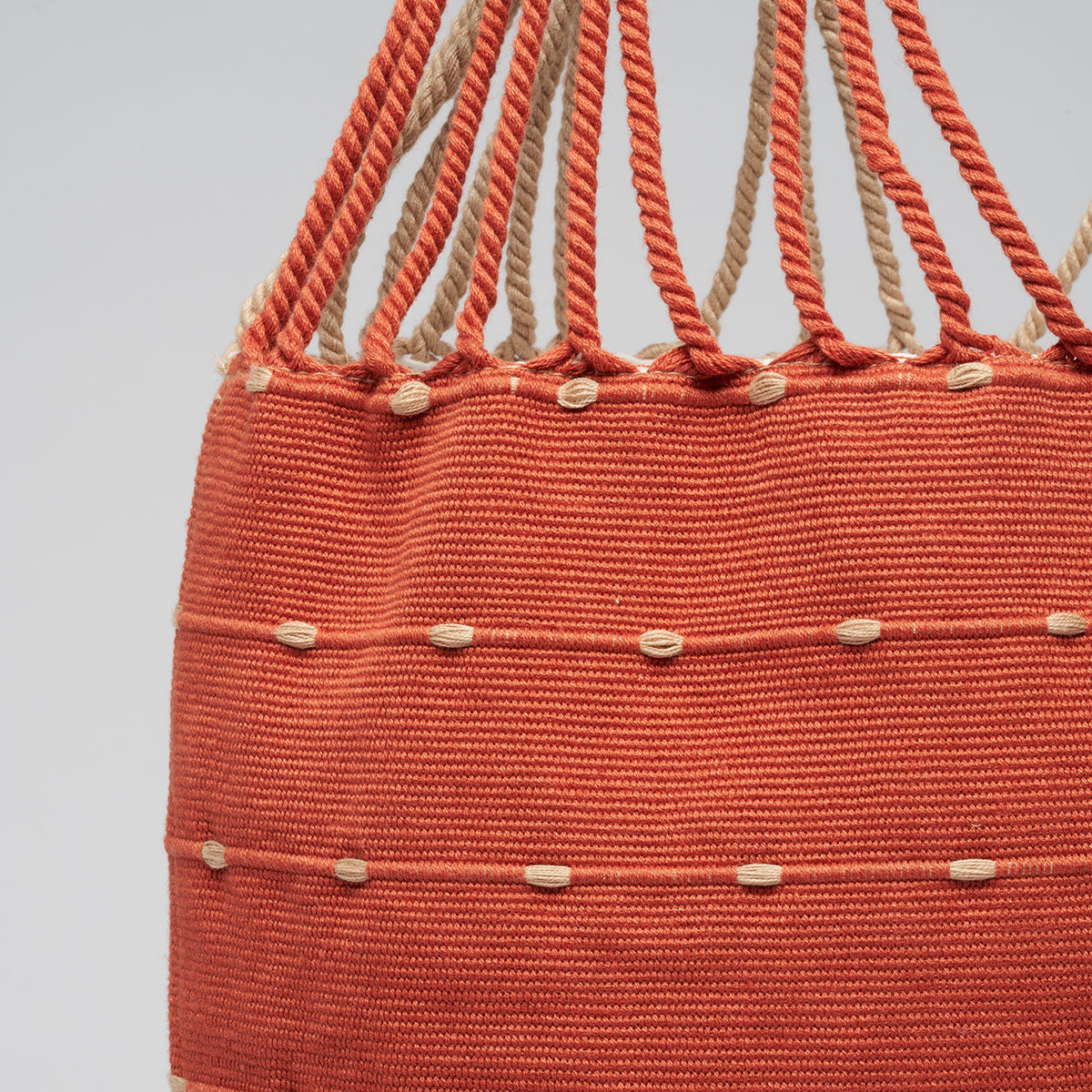 Close up detail of the front of Apolonia Tote in Desert Sands.