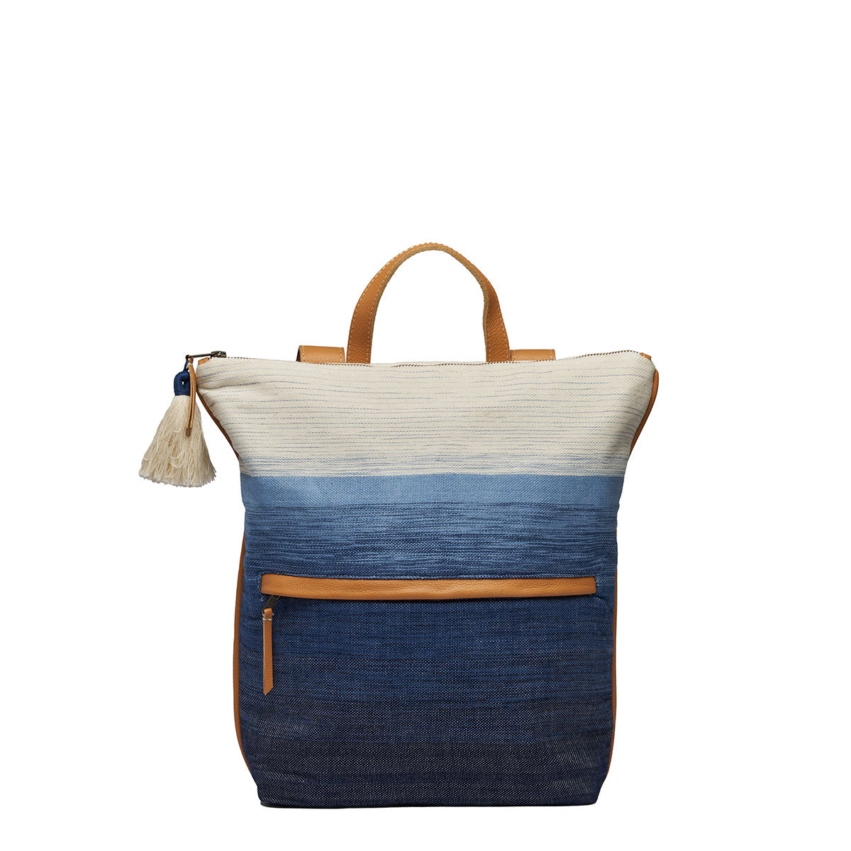 Front view of the Lorena Backpack in Ocean Breeze. It has a white to dark blue gradient pattern. It has leather straps and an exterior pocket. It has a cotton tassel.