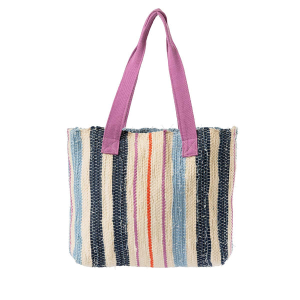 The front of the hand woven artisan Patricia Interwoven Tote in Spring Sherbert. It has a sky blue, dark blue, pink, and orange vertical striped pattern. It has pink handles.