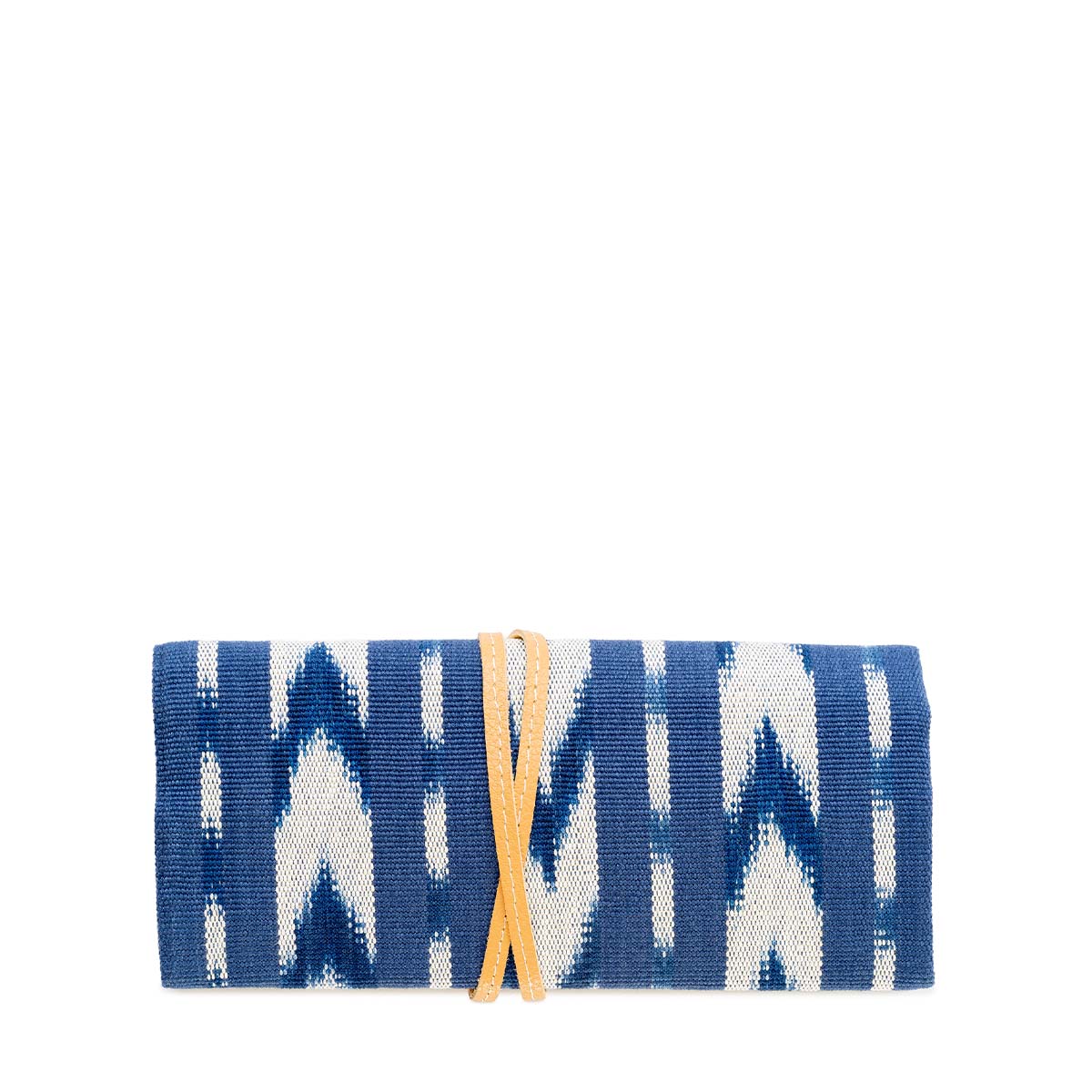 The back of the folded Lilia Jewelry Roll in Atitlán Hills pattern. It has a leather cord wrapped around the roll. It has vertical and chevron dark blue and white stripes.