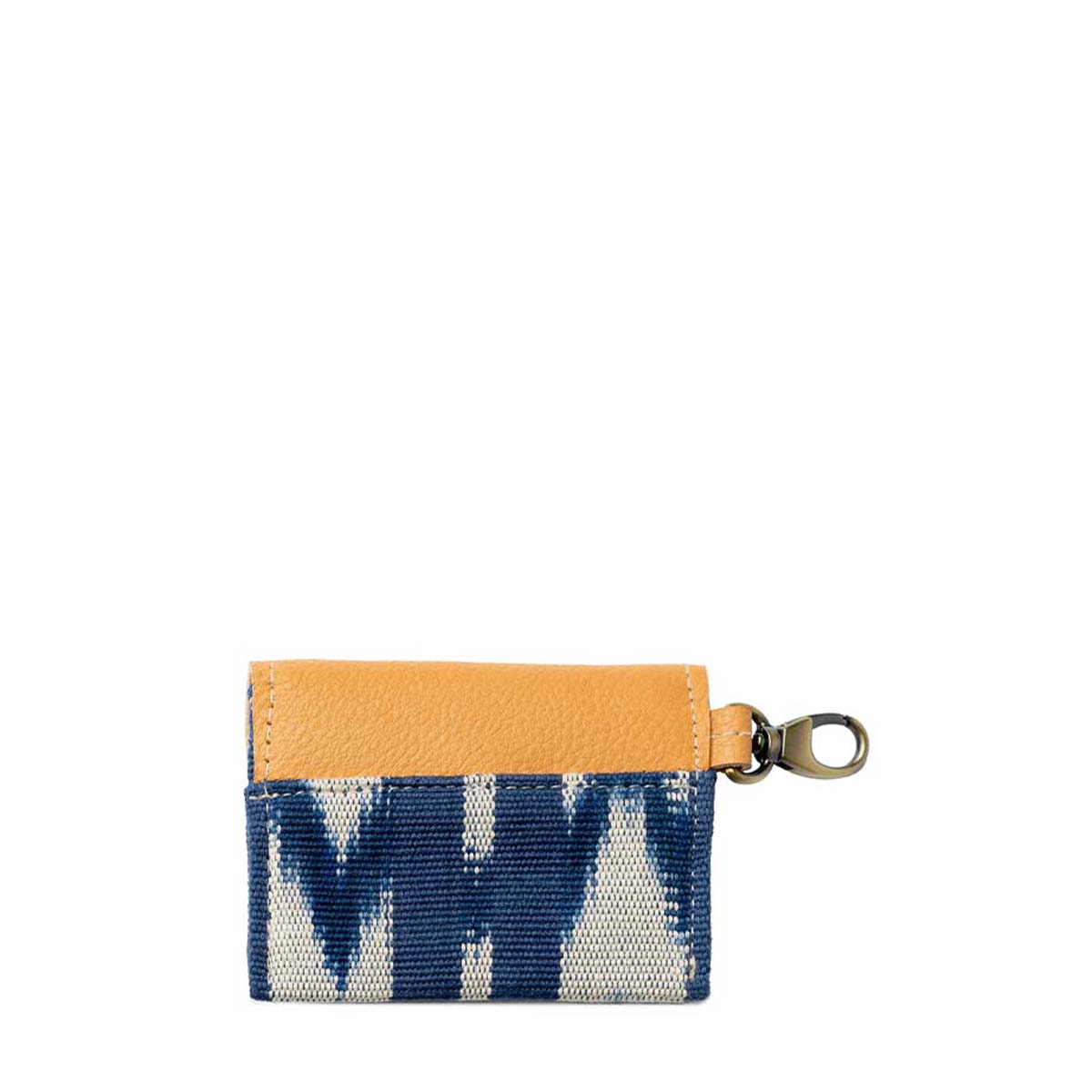 The back of the hand woven artisan Chabela Card Holder in Atitlán Hills pattern. It has vertical and chevron dark blue and white stripes, leather hem, and a brass claw clip.