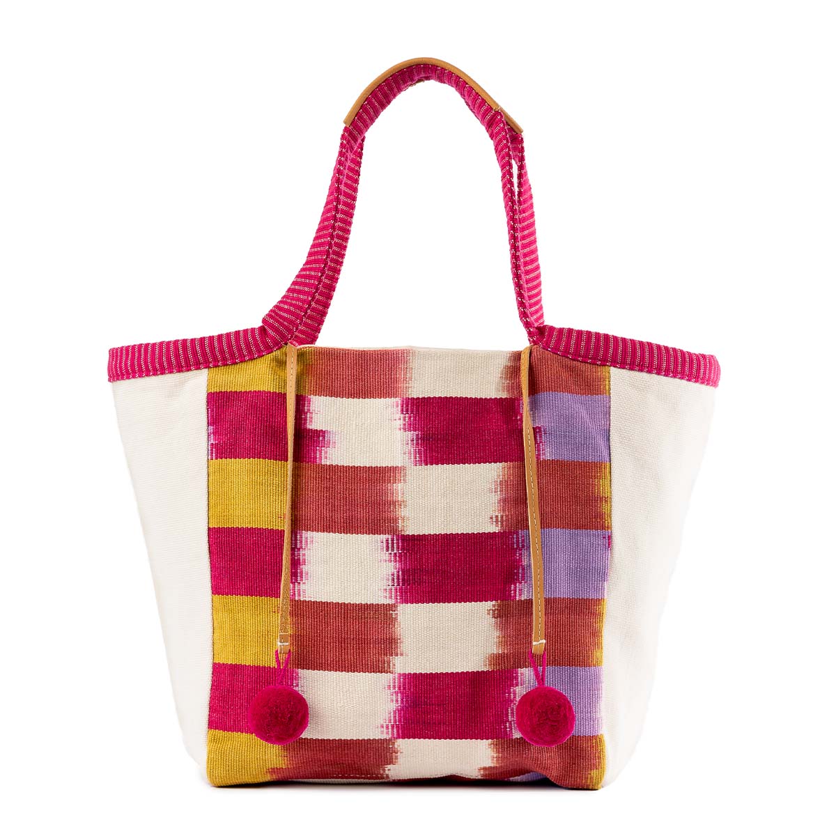 The front of the artisan hand woven Rosa Tote in Raspberry Paleta. It has a flame stitch red, orange, yellow, purple, and white stripes. It has two pink pompoms attached to leather cords.