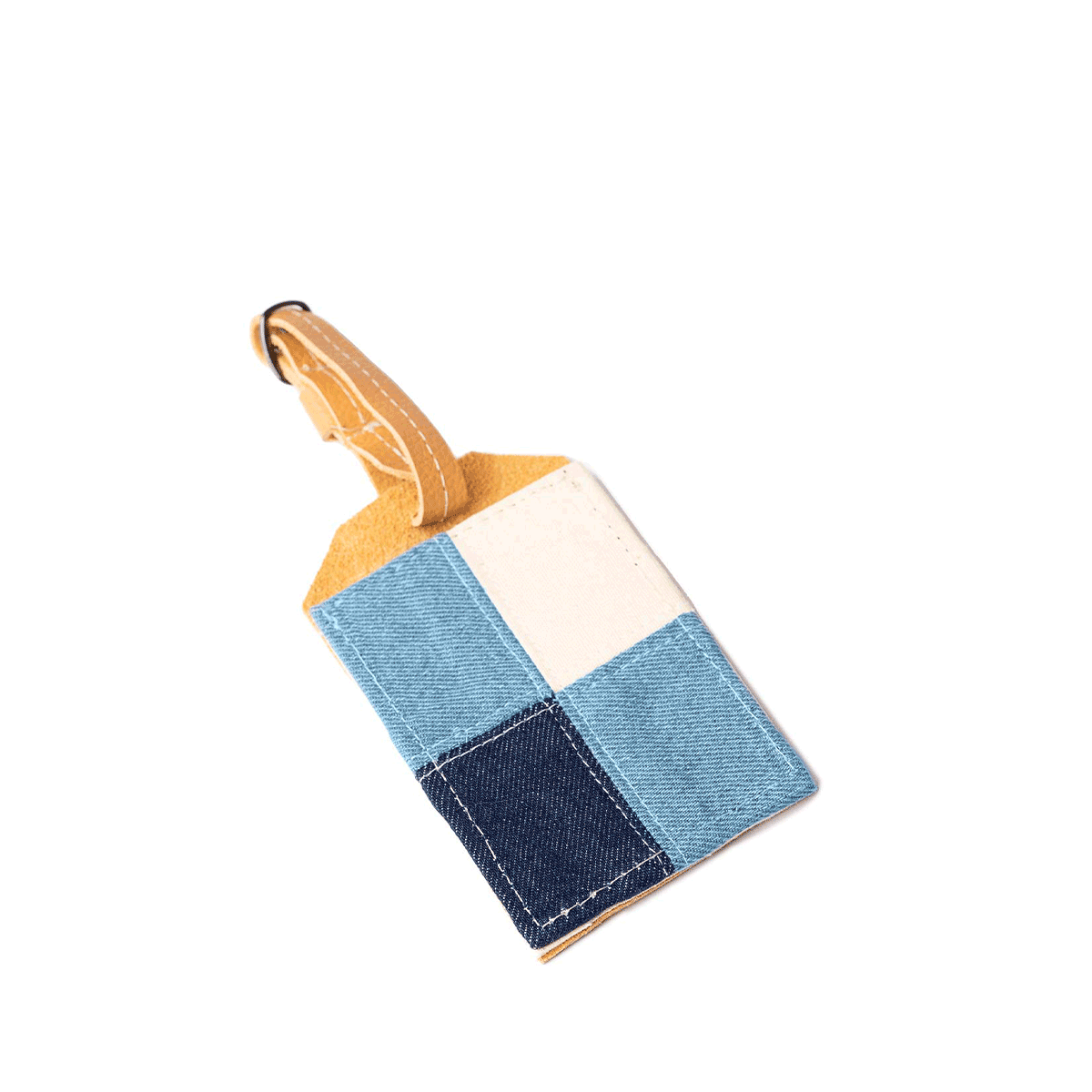 A GIF of the Ines Luggage Tag in 90s Denim, alternating between front and back.