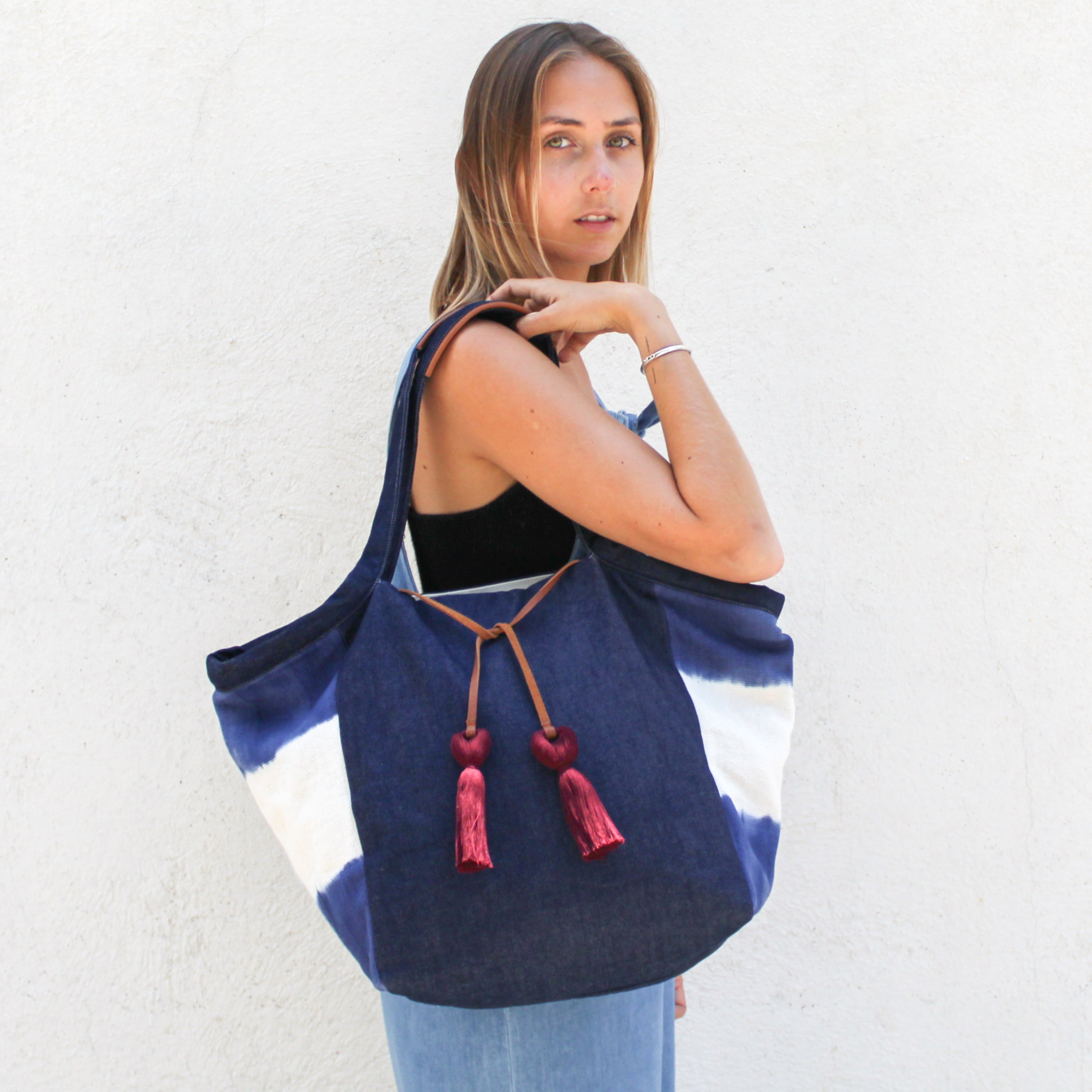 A model wears the Rosa Tote in Denim Dip-Dye.